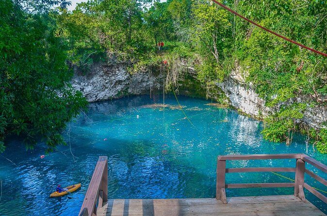 Full Day Tour to the Blue Lagoon and 7 Different Destinations - Playa Caleton: crescent beach, rocky setting, and Taino carvings