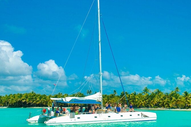 Saona Island Catamaran Adventure with Free Food and Transportation - Isla Saona beach time: lunch, open-air relaxation, and crowd math